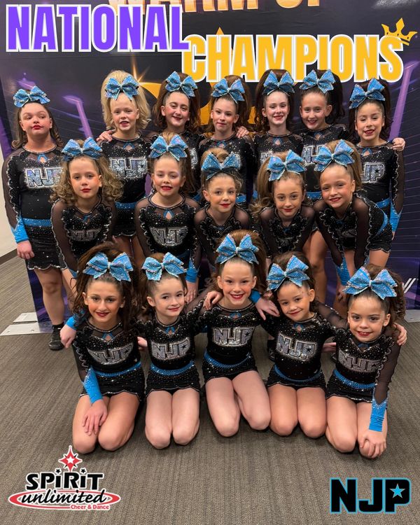 Young cheerleaders in matching outfits pose as national champions.