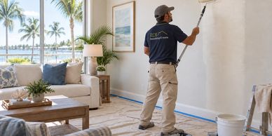 AI illustration: interior painter in an RCN uniform applying a fresh wall finish.