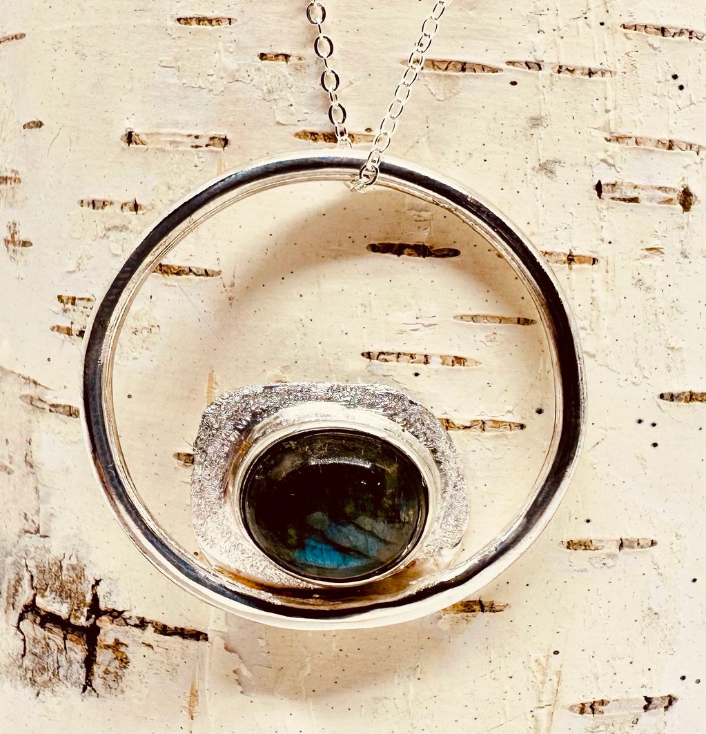 Labradorite stone ethically sourced from Canada set in hand crafted fine silver bezel O frame with a