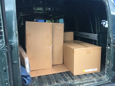 Our moving van with boxes ready to deliver to your destination.