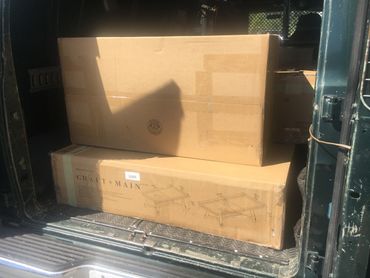 three big boxes packed and placed in our moving van. 