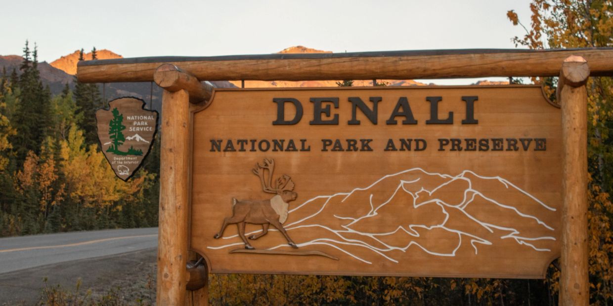 Wooden sign at Denali National Park entrance.