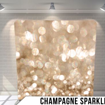 Backdrop with champagne sparkle bokeh lights in warm tones.