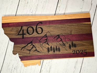 Wooden Montana-shaped plaque with mountains, trees, and the numbers 406 and 2025.