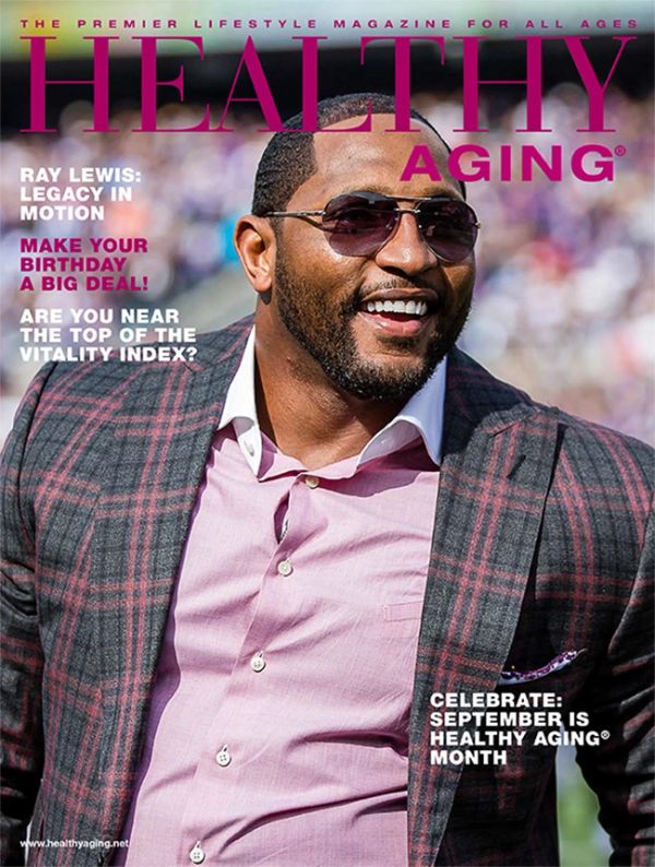 Magazine cover featuring a smiling man in sunglasses and a plaid jacket.