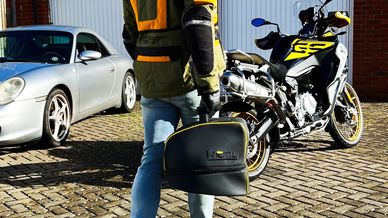 Remy luxury mountable helmet bag being carried unmounted