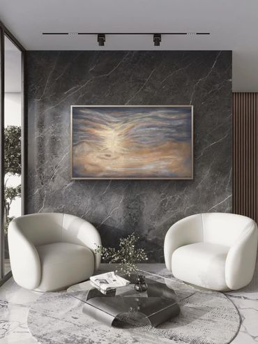 Modern sitting area with two white chairs and abstract art.