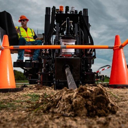 Directional drilling rig performing HDD bore with precision equipment for underground utility installation