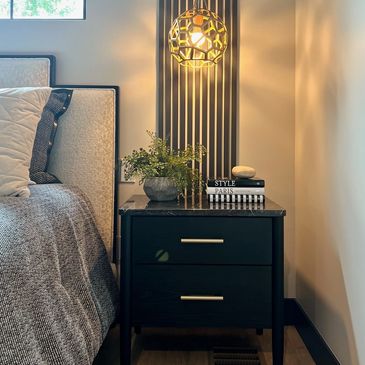Bedroom with accent wall detail behind the nightstand