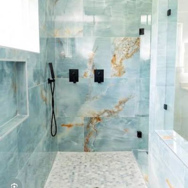 Large format tiles included in this bathroom remodel 