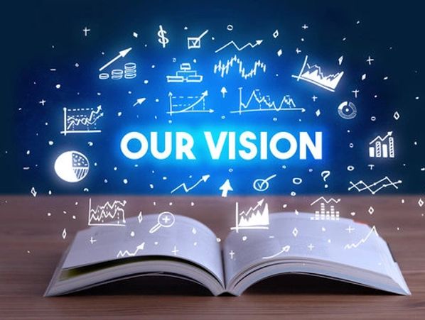 Open book with glowing text 'Our Vision' and business graphs above it.