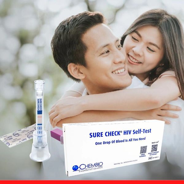 A happy couple embraces with a Sure Check HIV Self-Test kit displayed.