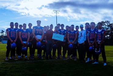 Group of Football Players Posing for a Picture