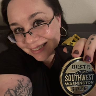 Woman smiling, holding a 2026 Best of Southwest Washington medal.