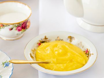 bowl of lemon curd on tea table