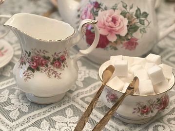 Vintage sugar bowl and creamer with gold tongs