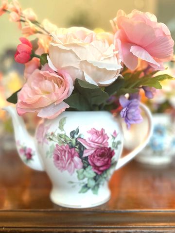 Vintage teapot with faux flowers