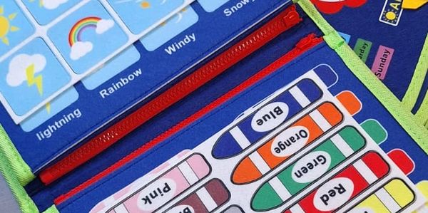 Color-coded educational chart showing crayons and weather icons for learning.