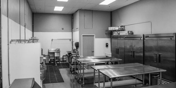 Shared kitchen space, commissary or commercial kitchen rental space. Spacious with reach in Refridgerator and freezer storage.
