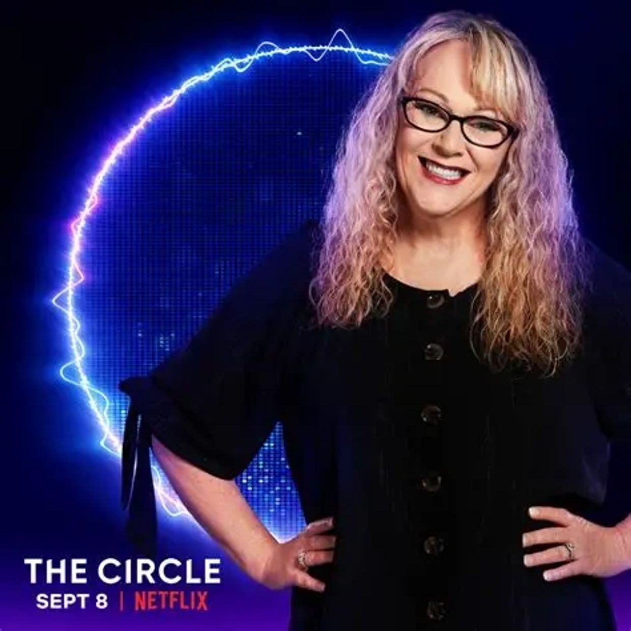 Smiling woman with glasses stands confidently against a glowing circle background.