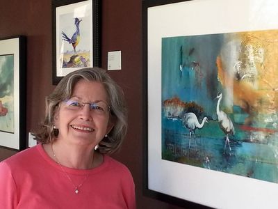 Eulalie with her painting, Interlude, at the Sonoran Desert Museum.