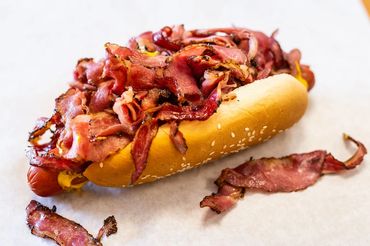 pastrami on 1/4lb hot dog, sesame bun