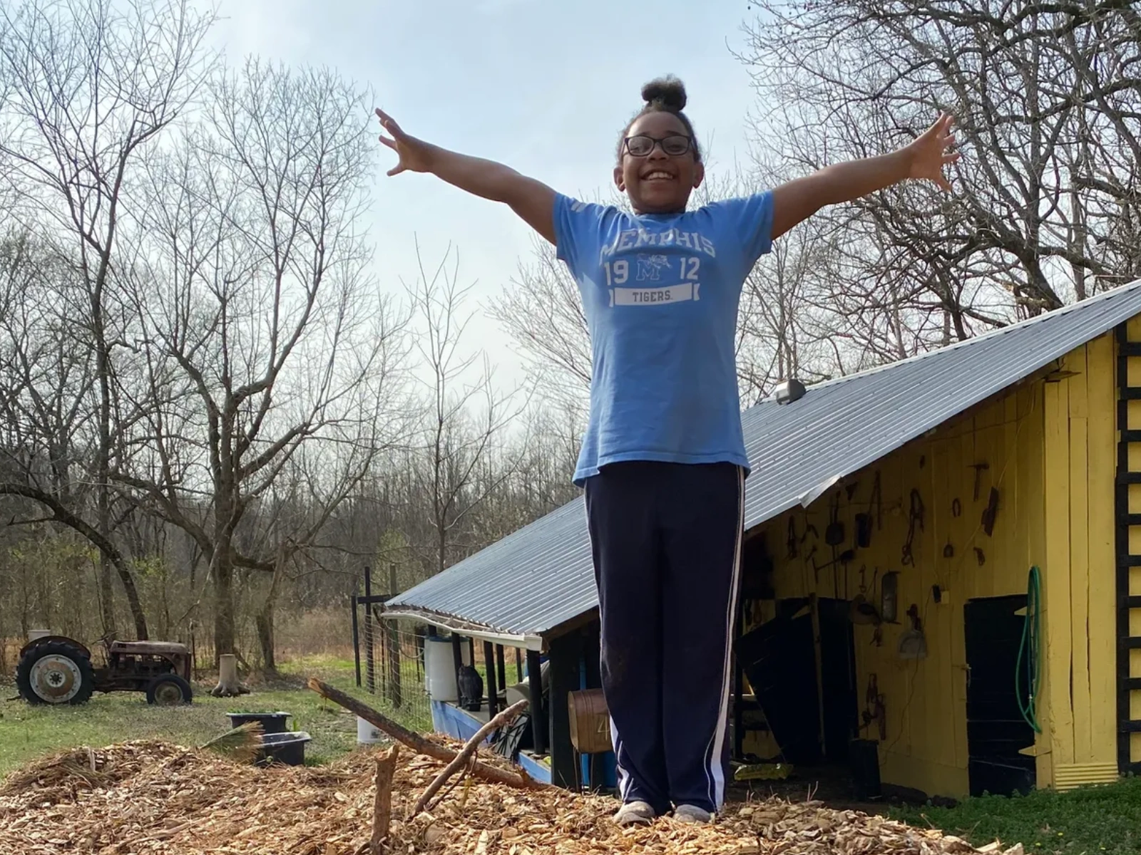 child volunteering at the farm