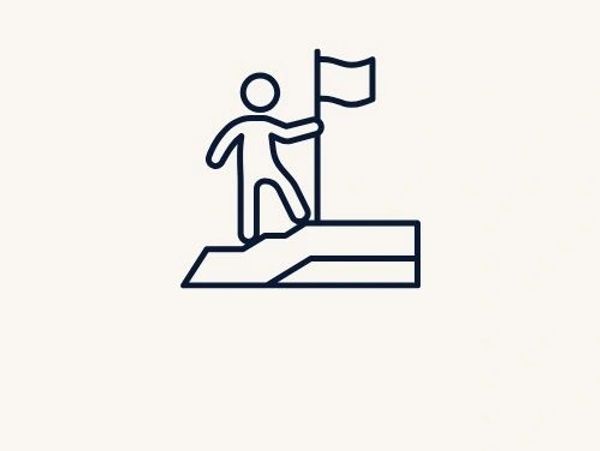 Ícone de conquista com pessoa segurando bandeira no topo.