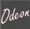 Neon sign displaying the word 'Odeon' on a dark background.