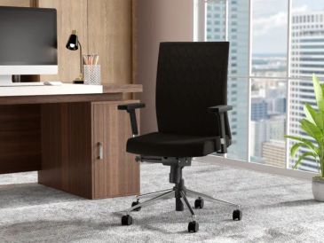 Black ergonomic office chair in a modern office.