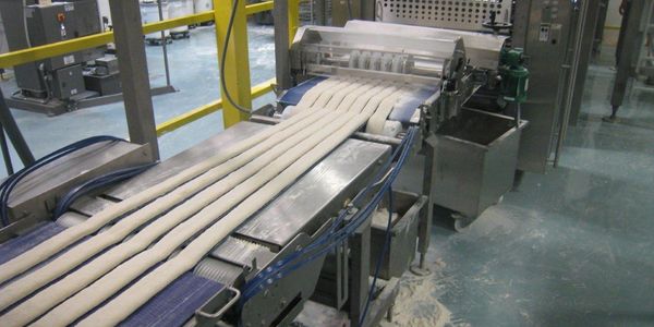 Bakery Equipment - Sheeting Line producing Bread, shown is strip cutting with Ciabatta Dough