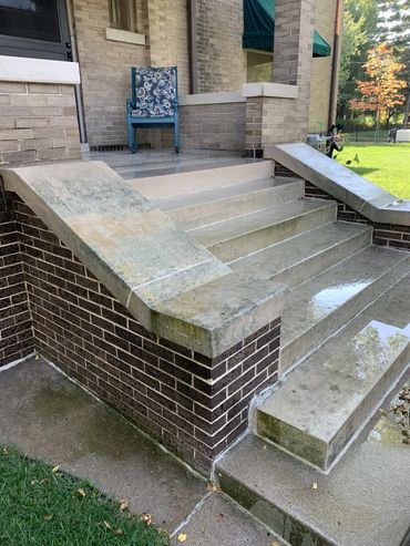 Sandstone entryway before being professionally power washed in Des Moines, Iowa