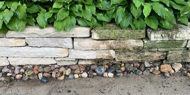 Limestone retaining wall half clean 