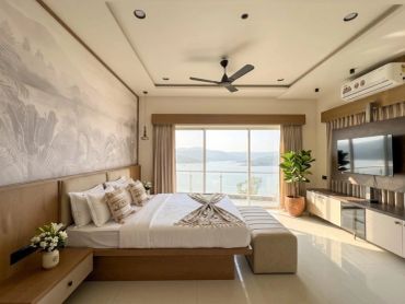 Bright modern bedroom with ocean view.