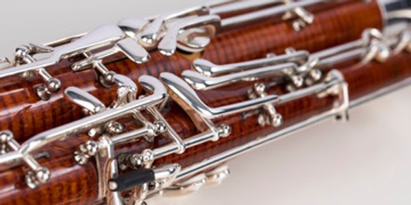 Close-up of a wooden bassoon with silver keys.