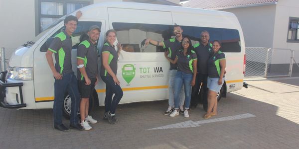 Tot Wa team and shuttle.