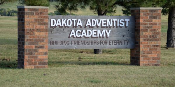 Iconic handcrafted wooden sign for Dakota Adventist Academy.