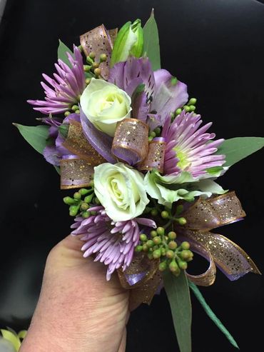 White and purple flowers tied with a ribbon