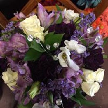 A bunch of violet and white flowers