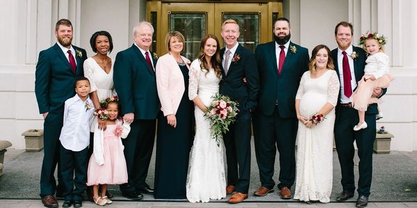 A group photo of the bride and her guests