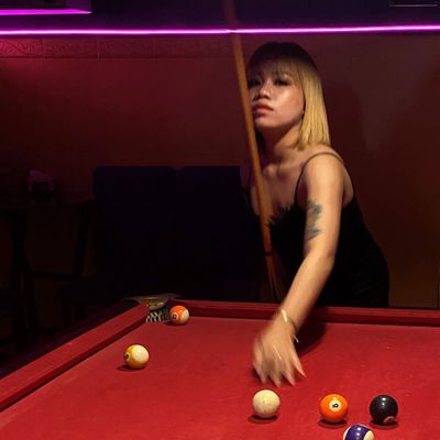 Cambodian bargirl playing pool