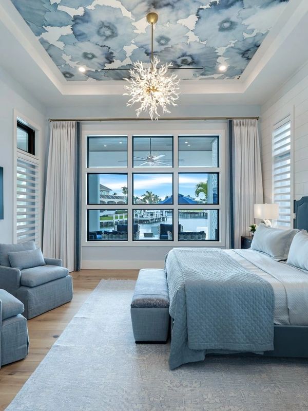 Serene coastal bedroom showcases our expertise in sophisticated design with natural elements. 