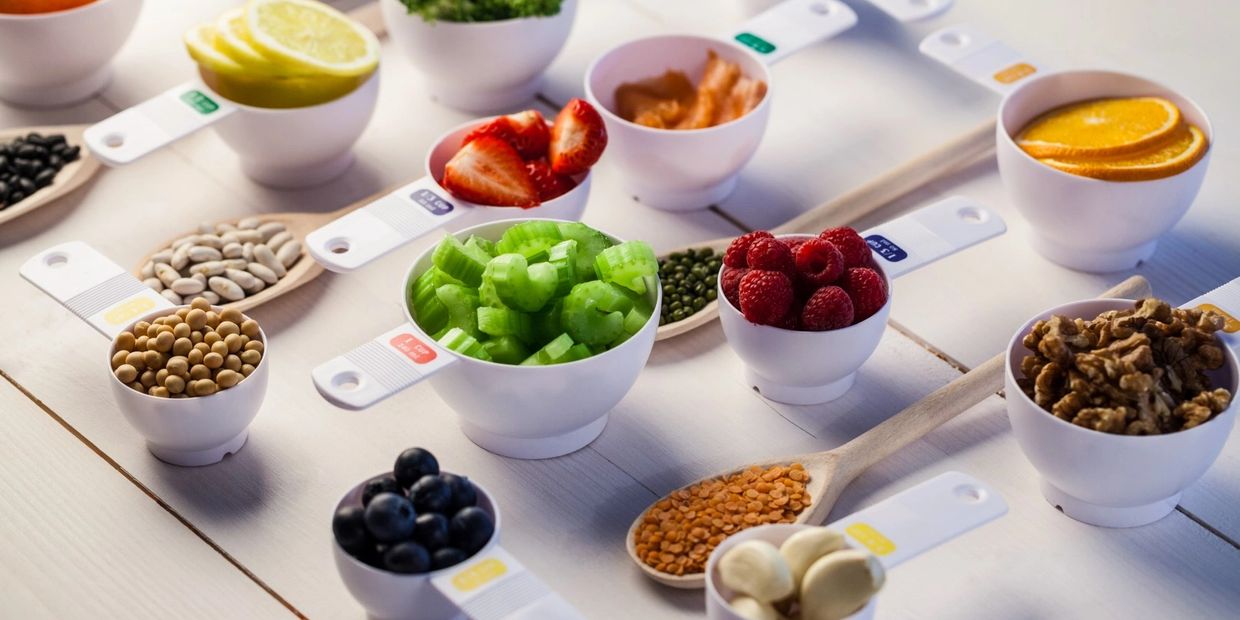 Portioned cups of healthy ingredients on a table.