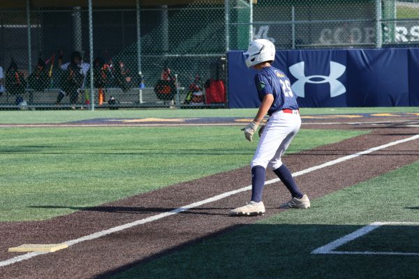 Baseball player ready on base during a game.