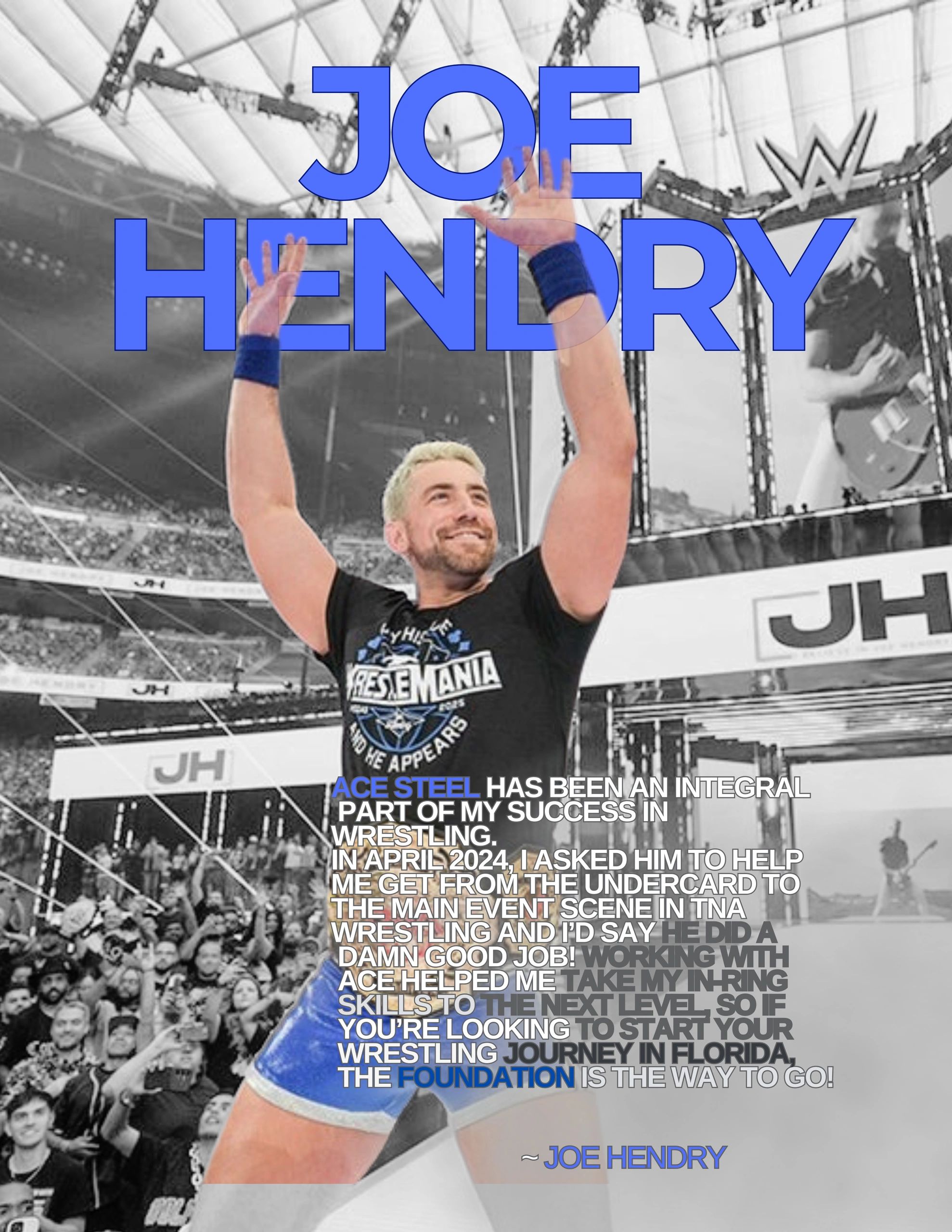 Wrestler Joe Hendry raises his arms in a packed arena with a WrestleMania shirt.