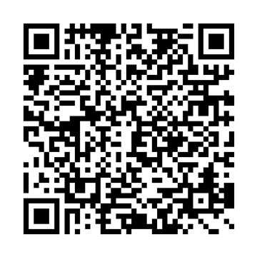 Black and white QR code.