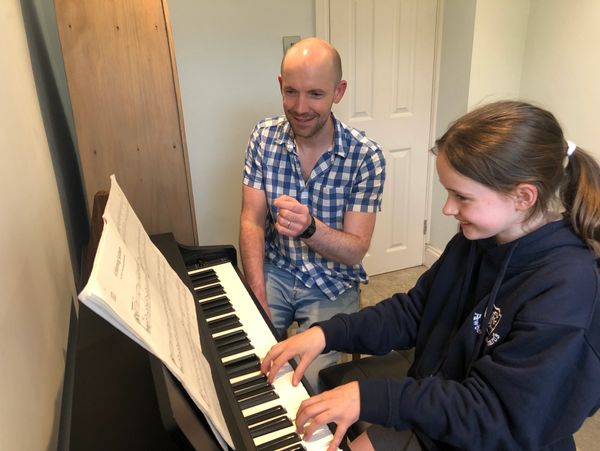 Danny Bage during piano lesson