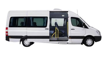 White passenger van with sliding door open.