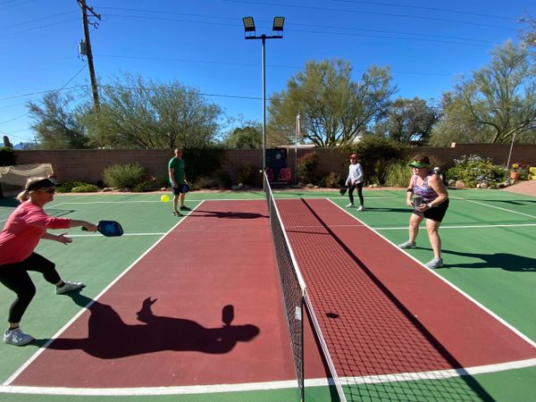 Dinking rally during a pickleball clinic.