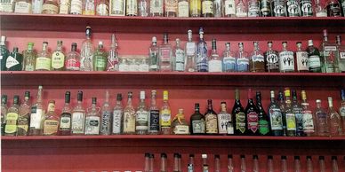 Shelves filled with various liquor bottles.